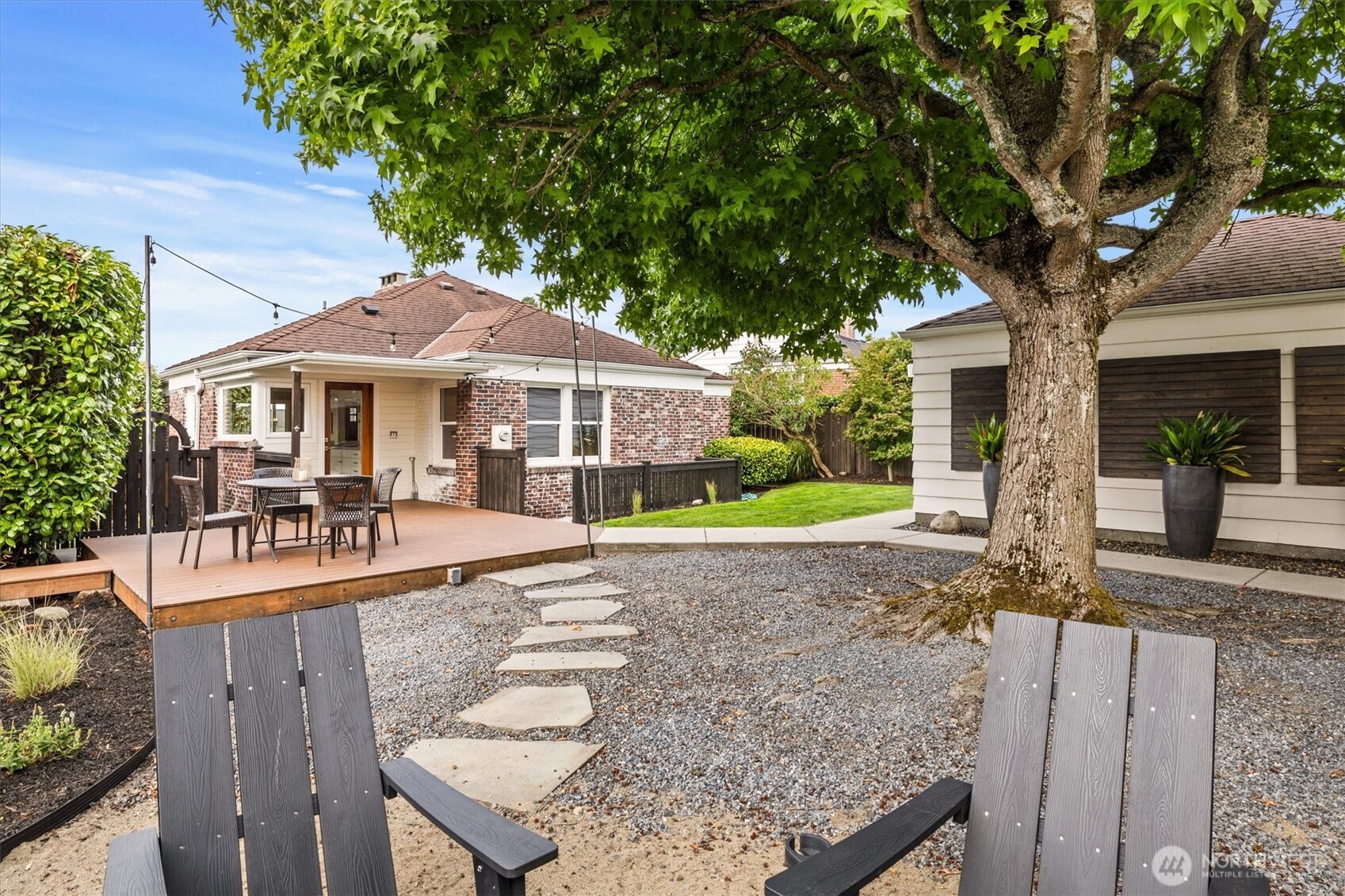 1940 Edgemont Place West Seattle, WA 98199 - Photo 32 of 37 a patio with a table and chairs under an umbrella
