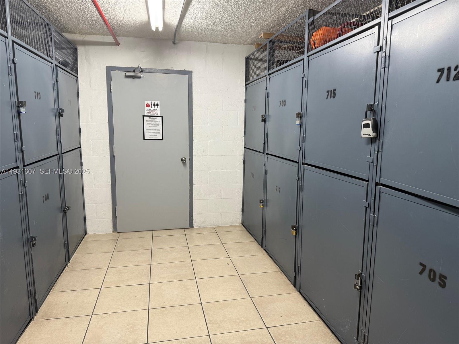 17011 North Bay Road, Unit 204 Sunny Isles Beach, FL 33160 - Photo 11 of 43 a view of a refrigerator in kitchen and white cabinets