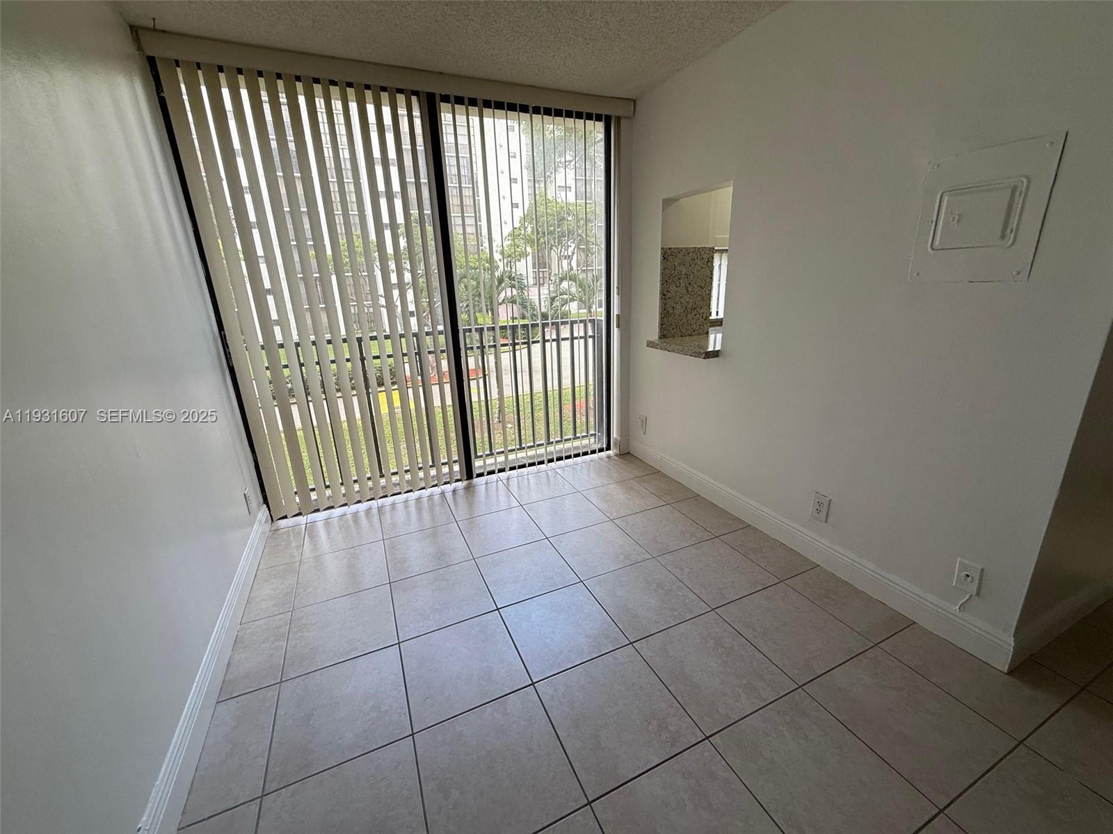17011 North Bay Road, Unit 204 Sunny Isles Beach, FL 33160 - Photo 30 of 43 a view of an empty room with a window