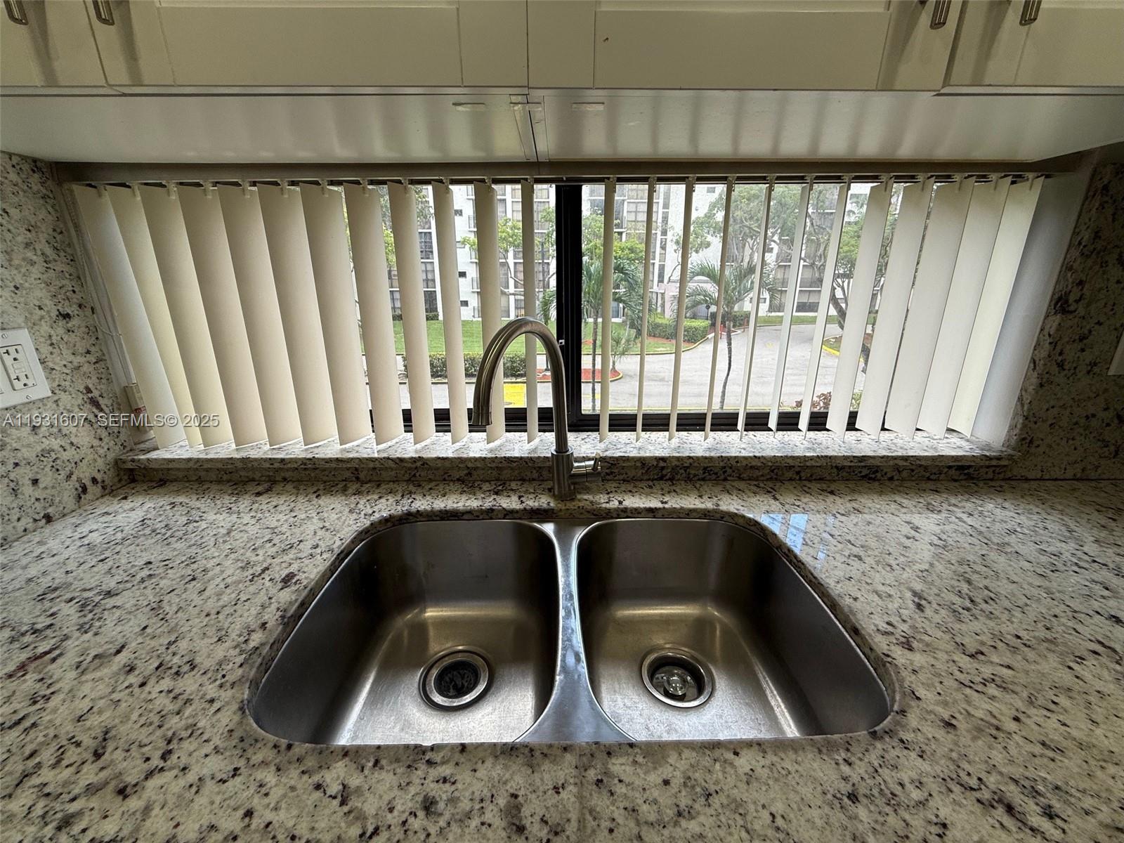 17011 North Bay Road, Unit 204 Sunny Isles Beach, FL 33160 - Photo 36 of 43 a close view of sink and tap