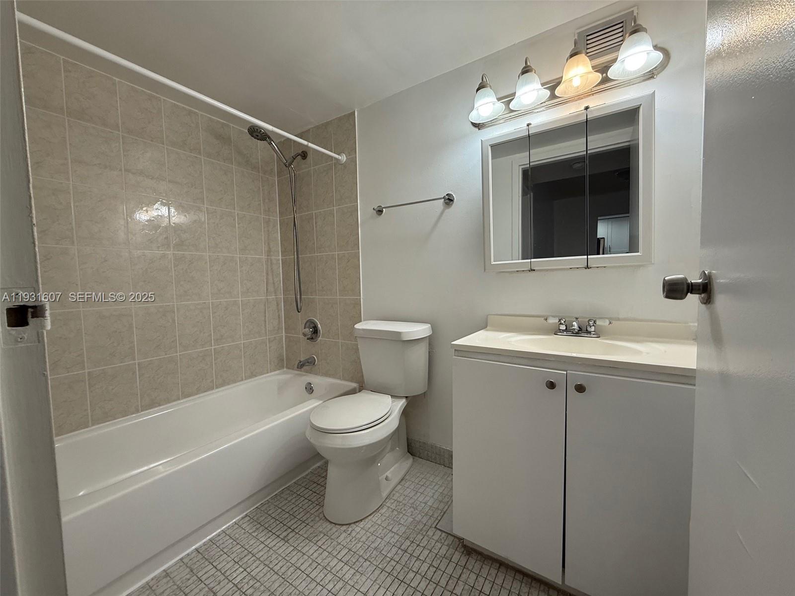 17011 North Bay Road, Unit 204 Sunny Isles Beach, FL 33160 - Photo 40 of 43 a bathroom with a sink toilet a shower and bathtub