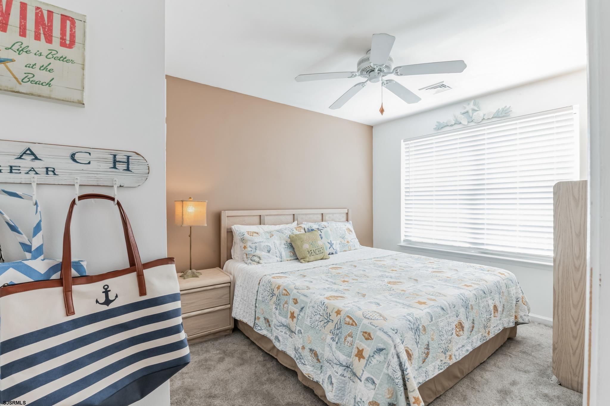 1 MacDonald Place Brigantine, NJ 08203 - Photo 18 of 36 a bedroom with a bed and a window