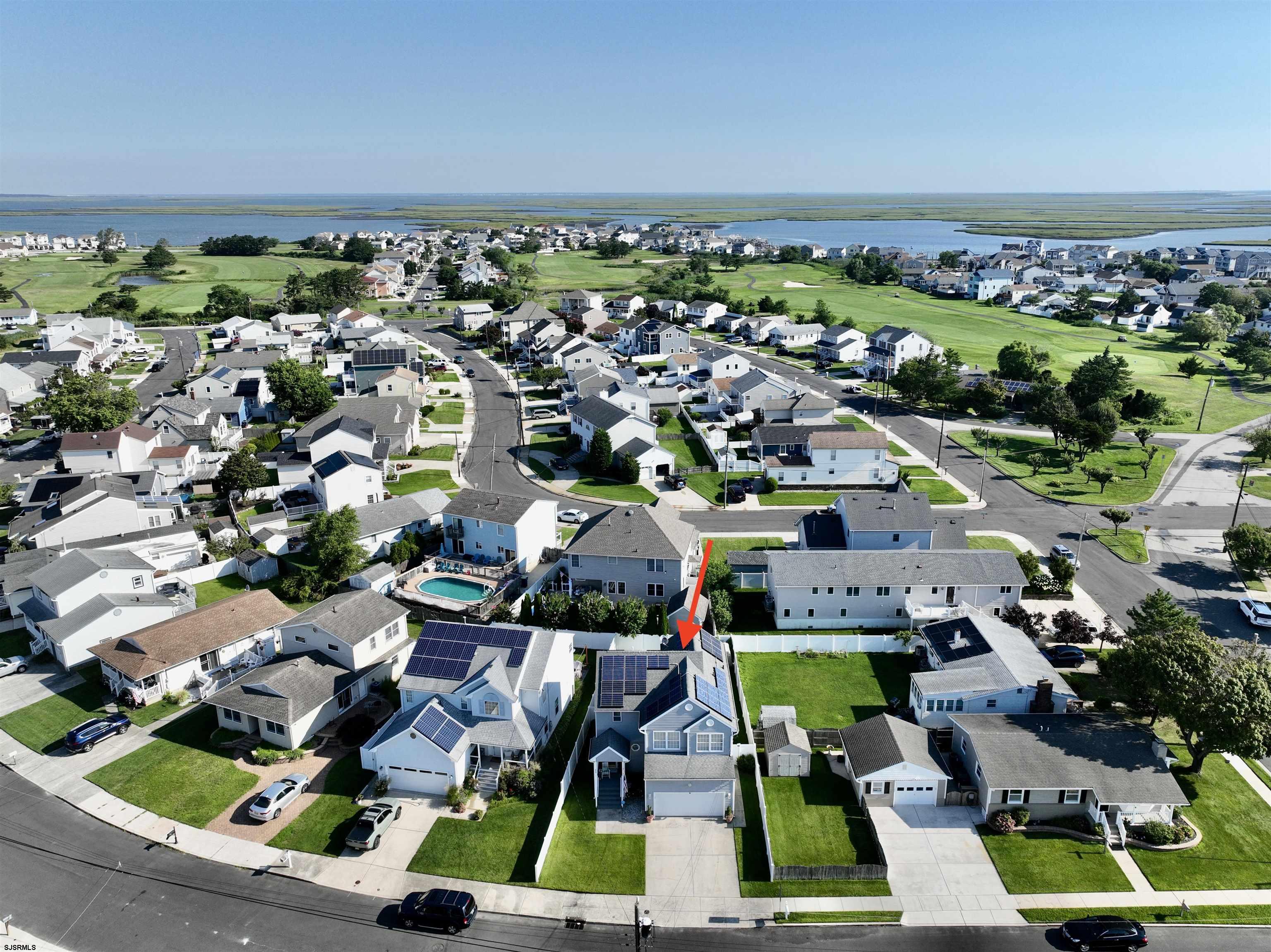 1 MacDonald Place Brigantine, NJ 08203 - Photo 2 of 36 an aerial view of residential houses with outdoor space and swimming pool