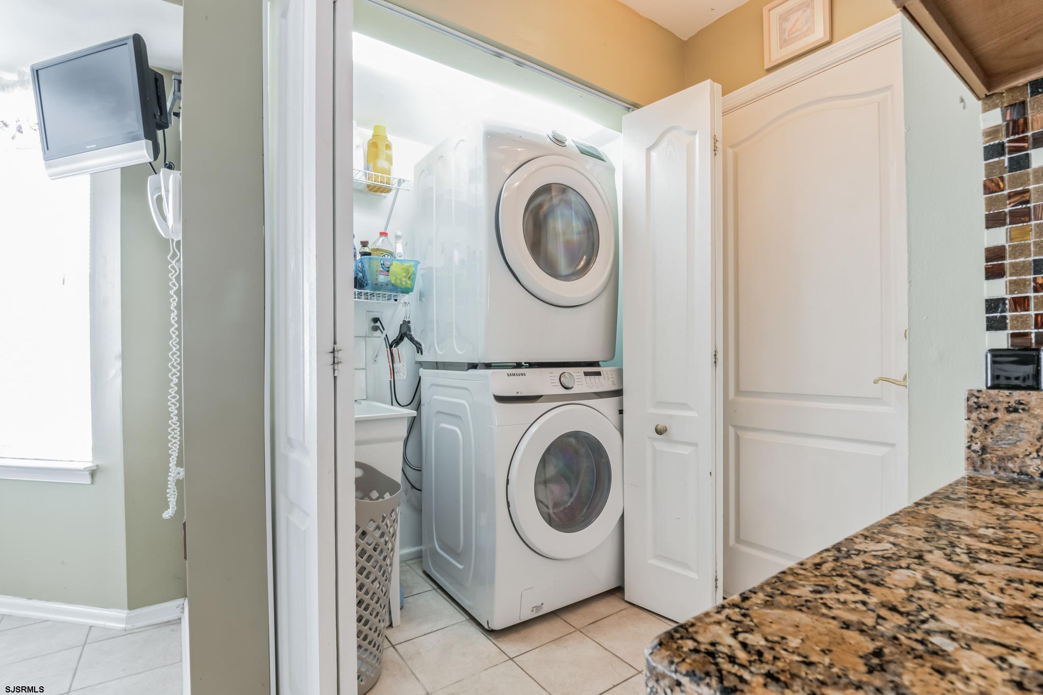 1 MacDonald Place Brigantine, NJ 08203 - Photo 24 of 36 a utility room with dryer and washer