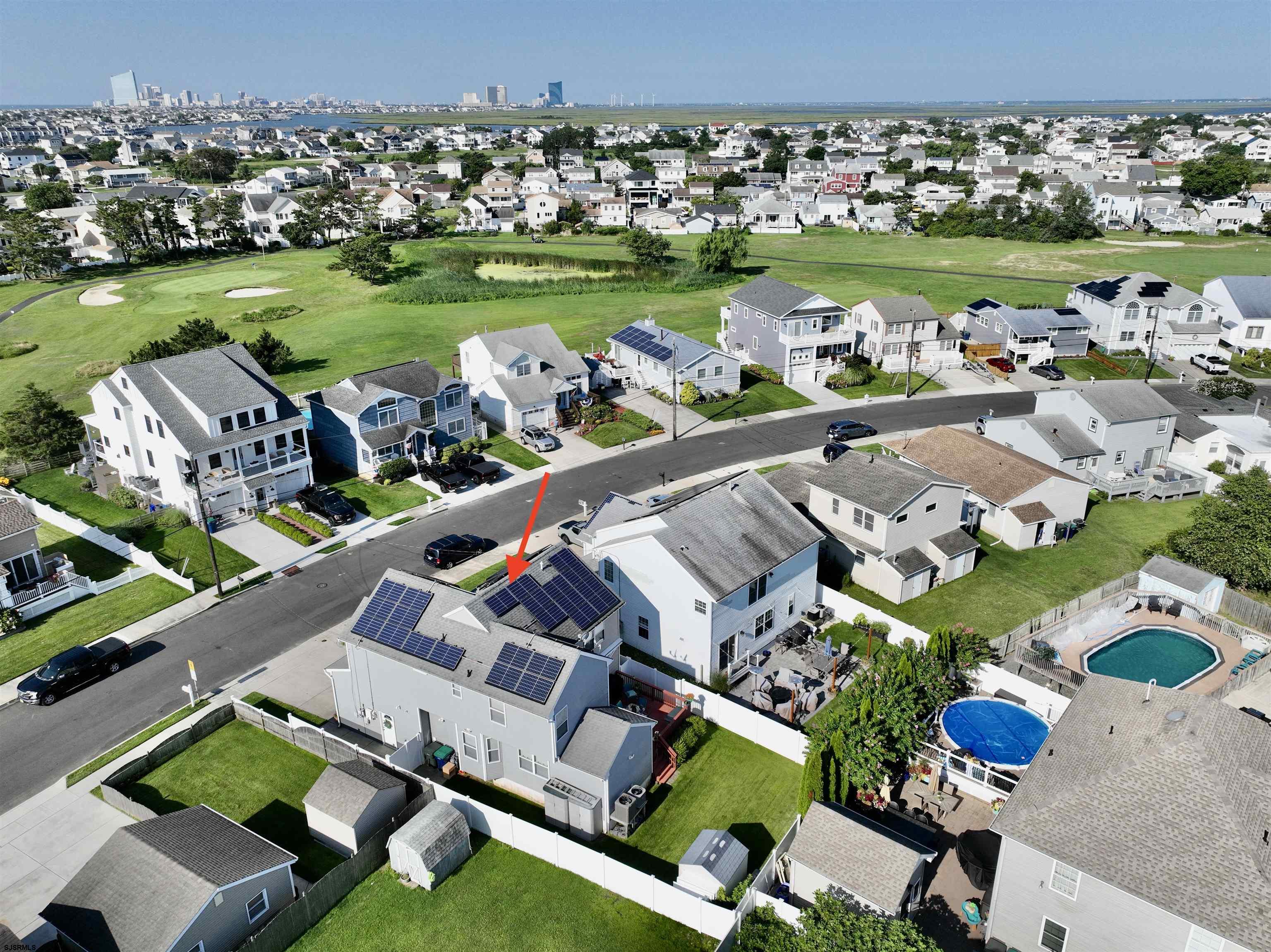 1 MacDonald Place Brigantine, NJ 08203 - Photo 31 of 36 an aerial view of a house a garden and lake view