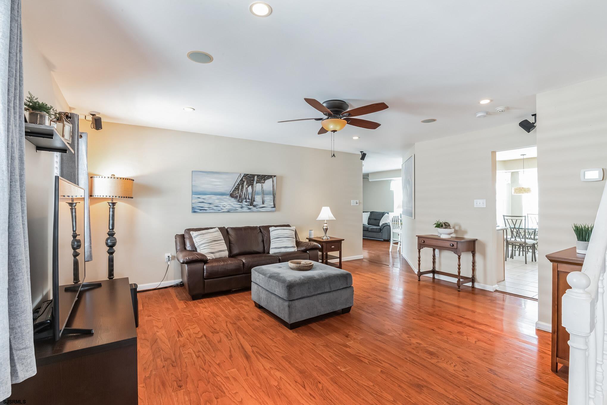 1 MacDonald Place Brigantine, NJ 08203 - Photo 6 of 36 a living room with furniture and a flat screen tv