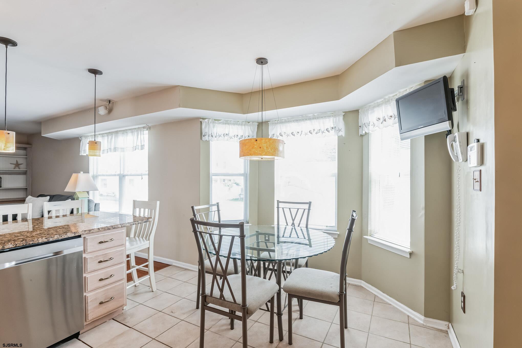 1 MacDonald Place Brigantine, NJ 08203 - Photo 9 of 36 a dining room with furniture and window