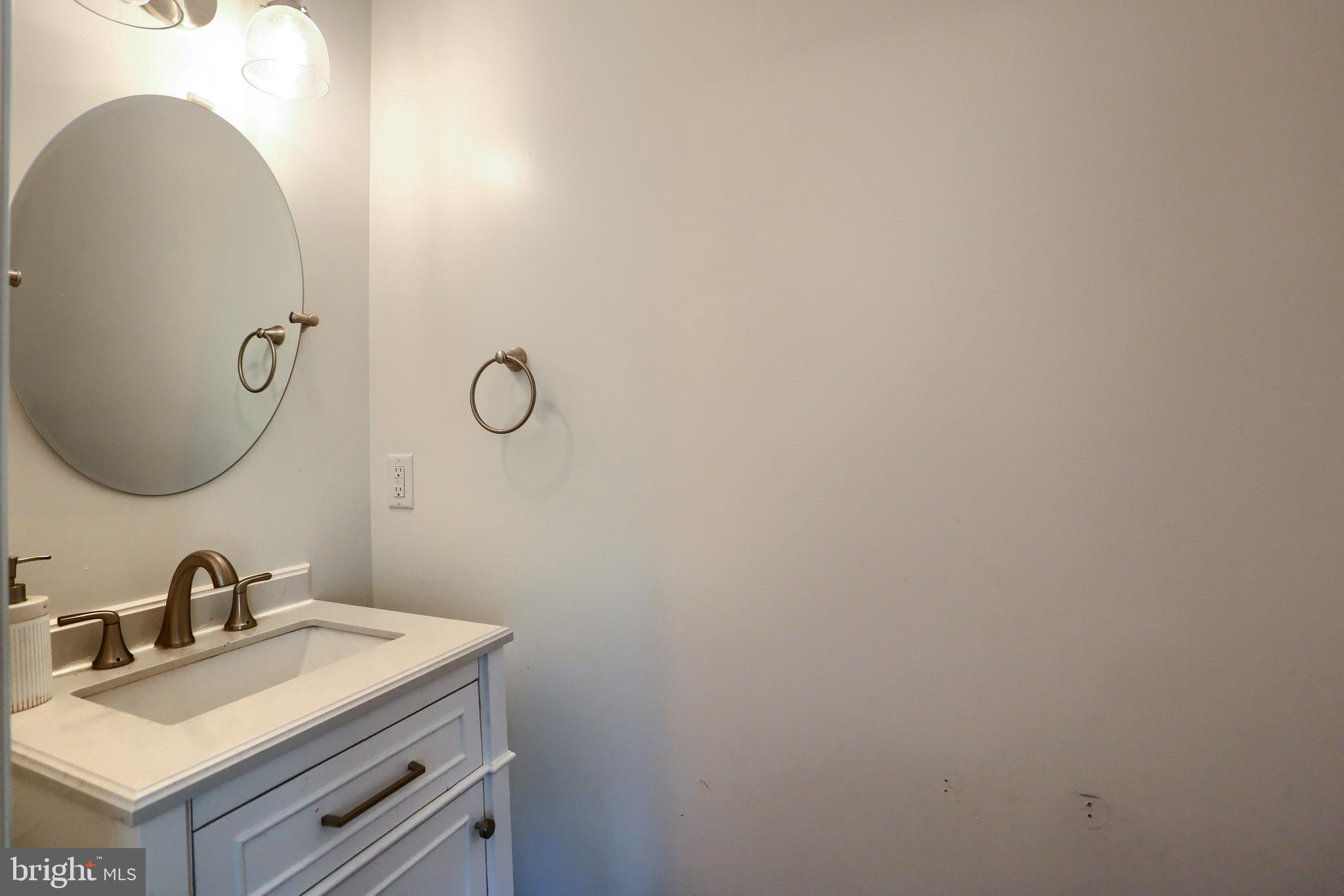 4118 Buckwheat Road Millerstown, PA 17062 - Photo 15 of 26 a bathroom with a sink and mirror