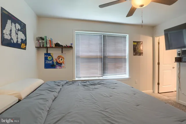a bed room with a bed and a chandelier