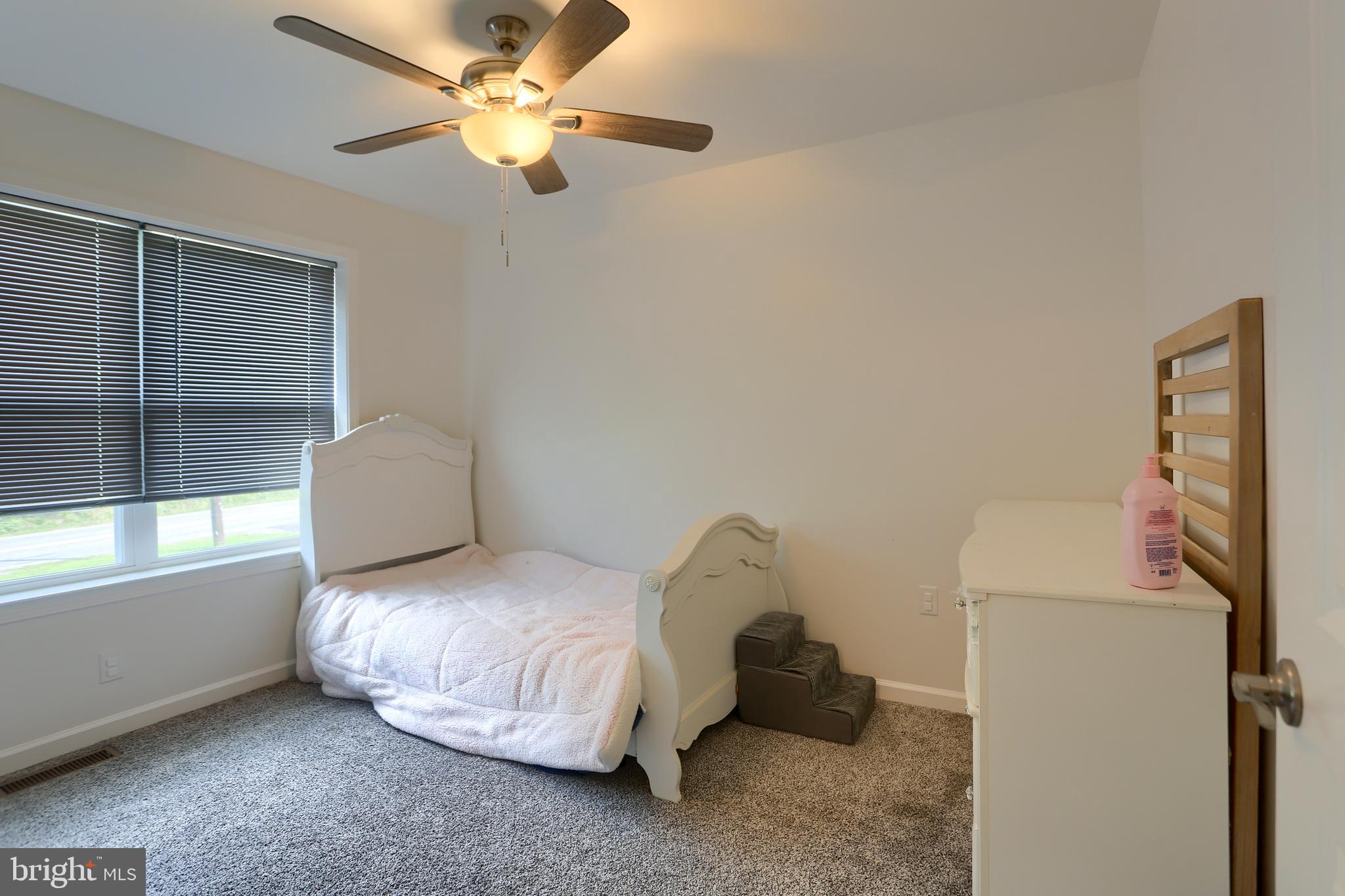 4118 Buckwheat Road Millerstown, PA 17062 - Photo 20 of 26 a bedroom with a bed and a ceiling fan