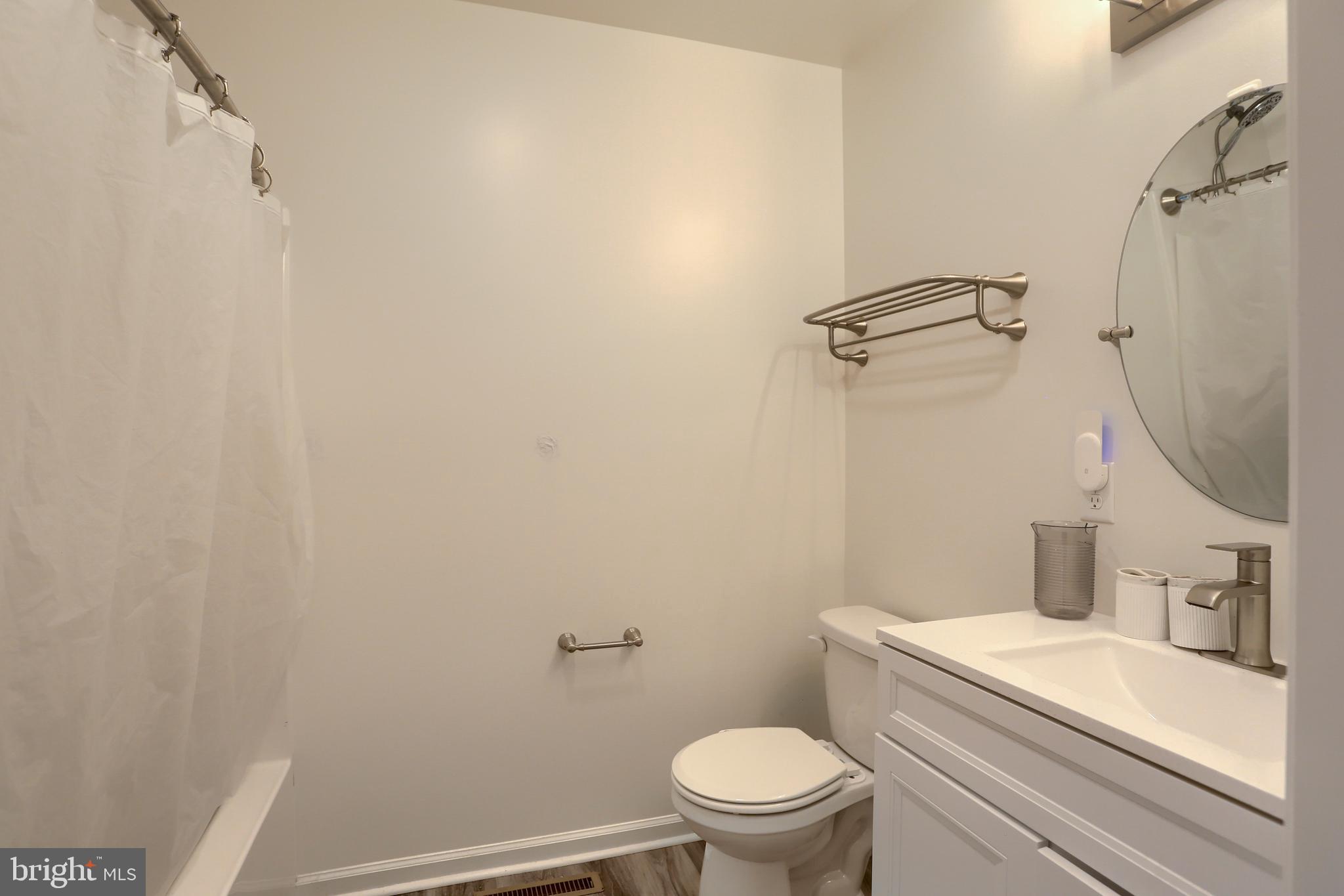 4118 Buckwheat Road Millerstown, PA 17062 - Photo 23 of 26 a white toilet sitting next to a bathroom sink