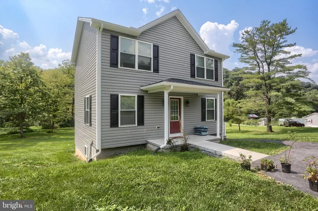 front view of a house with a yard