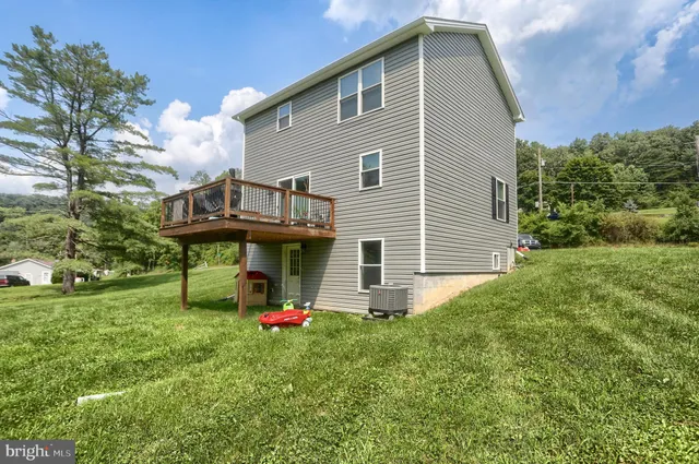 a front view of a house with swing
