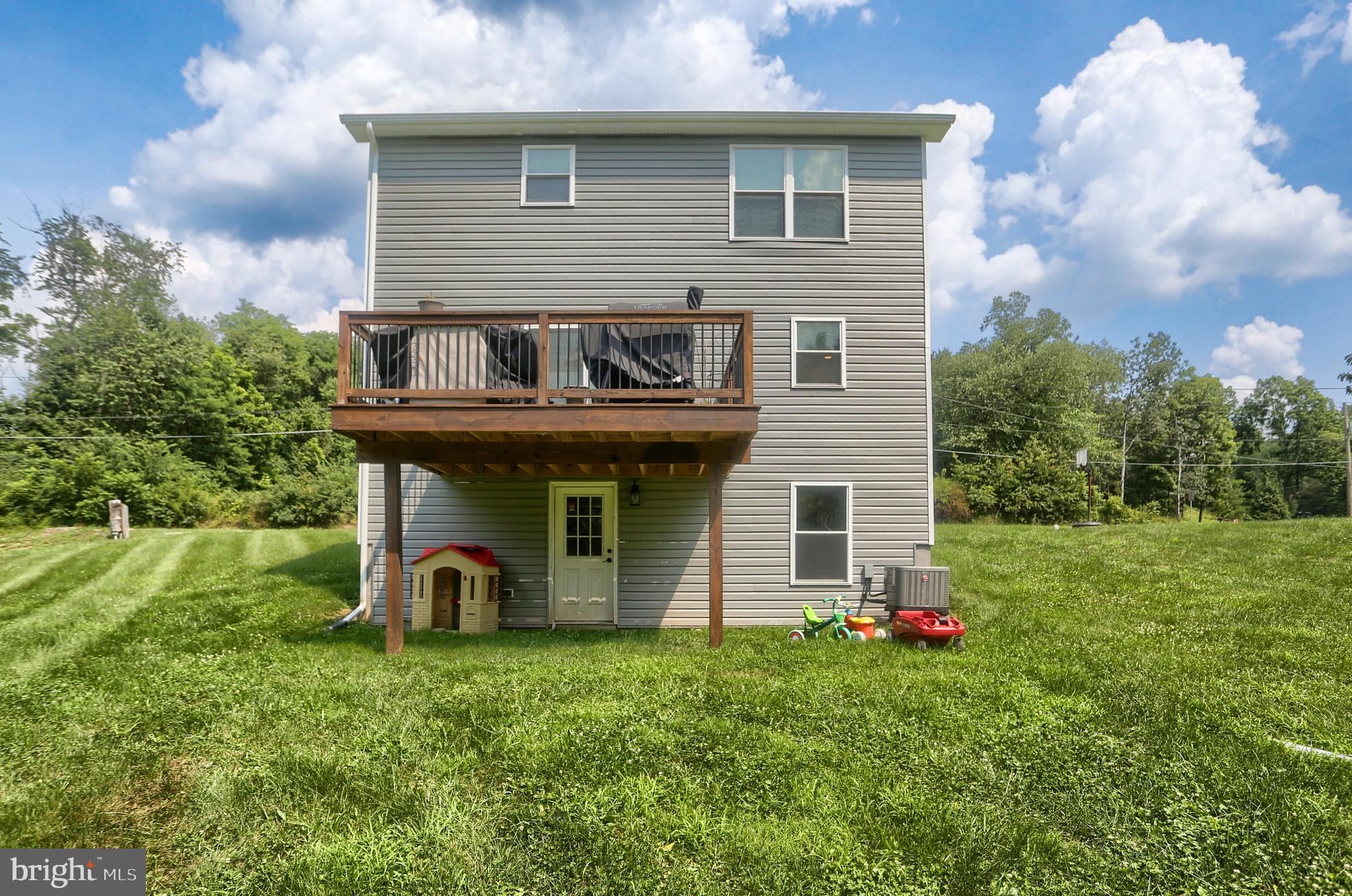 4118 Buckwheat Road Millerstown, PA 17062 - Photo 5 of 26 a view of a house with yard and a garden