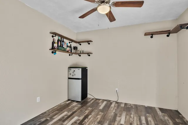 a view of an entryway with wooden floor