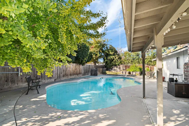 a view of a swimming pool with a patio