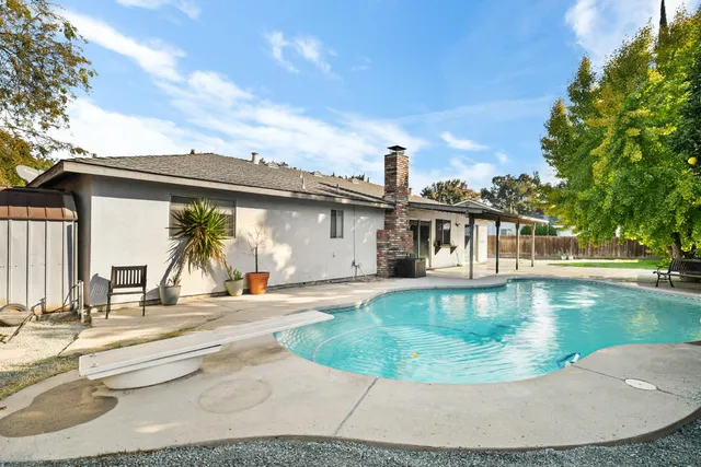 a view of a swimming pool with a patio
