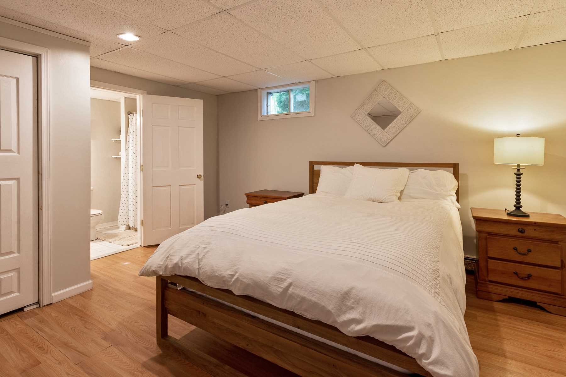7 Finkle Road Pine Plains, NY 12546 - Photo 20 of 30 a large bed sitting in a bedroom next to a window