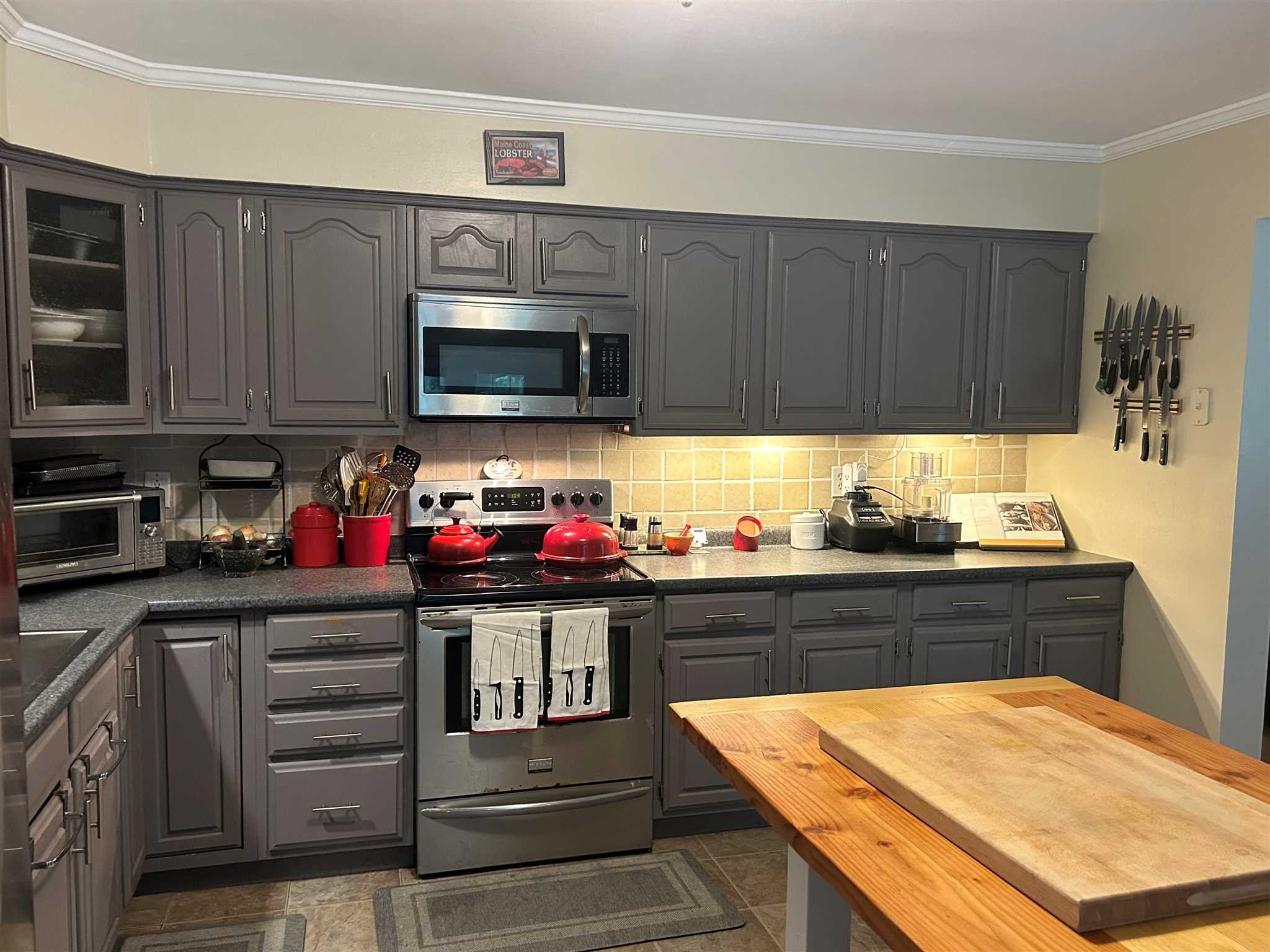 7 Finkle Road Pine Plains, NY 12546 - Photo 7 of 30 a kitchen with stainless steel appliances granite countertop a stove and cabinets