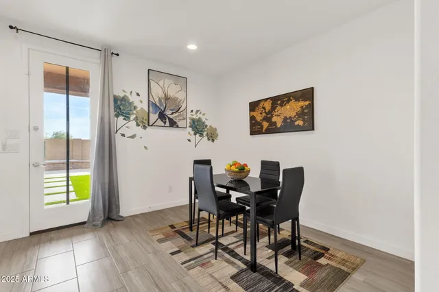 a kitchen with white cabinets and appliances