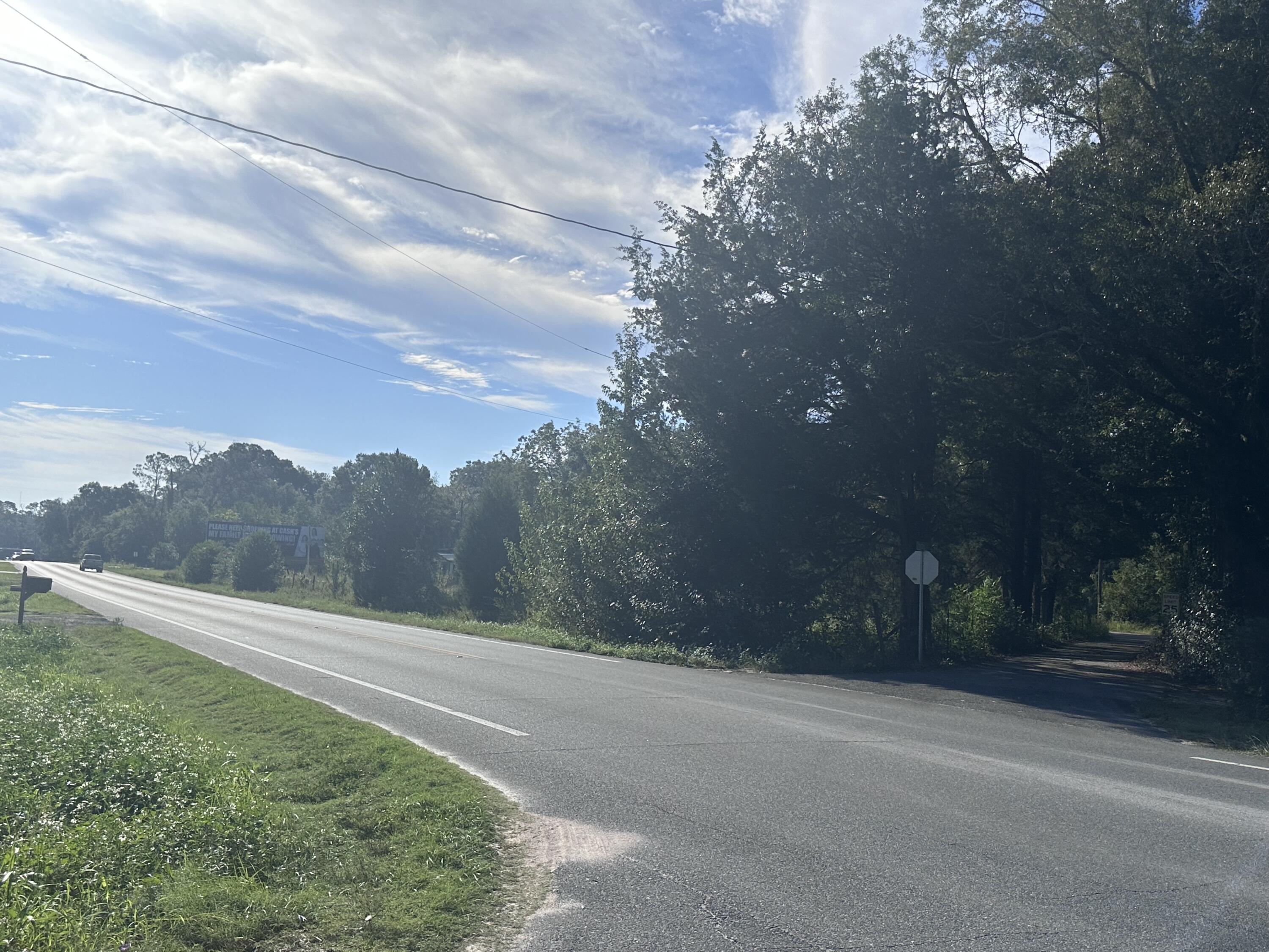 a view of a road with a yard