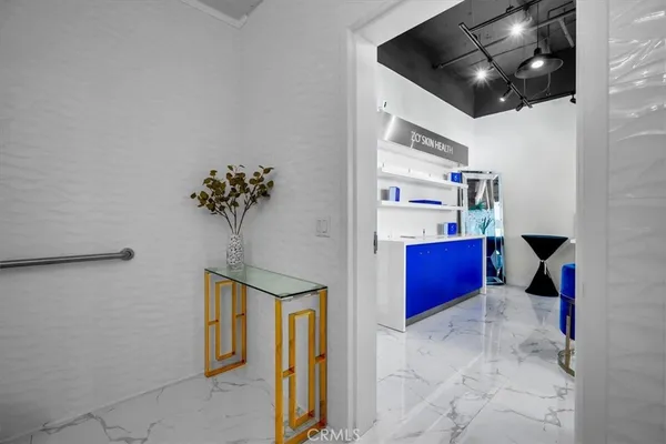 a kitchen with granite countertop a sink and a stove