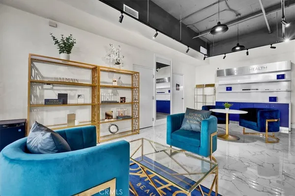 a kitchen with stainless steel appliances granite countertop a stove and a refrigerator