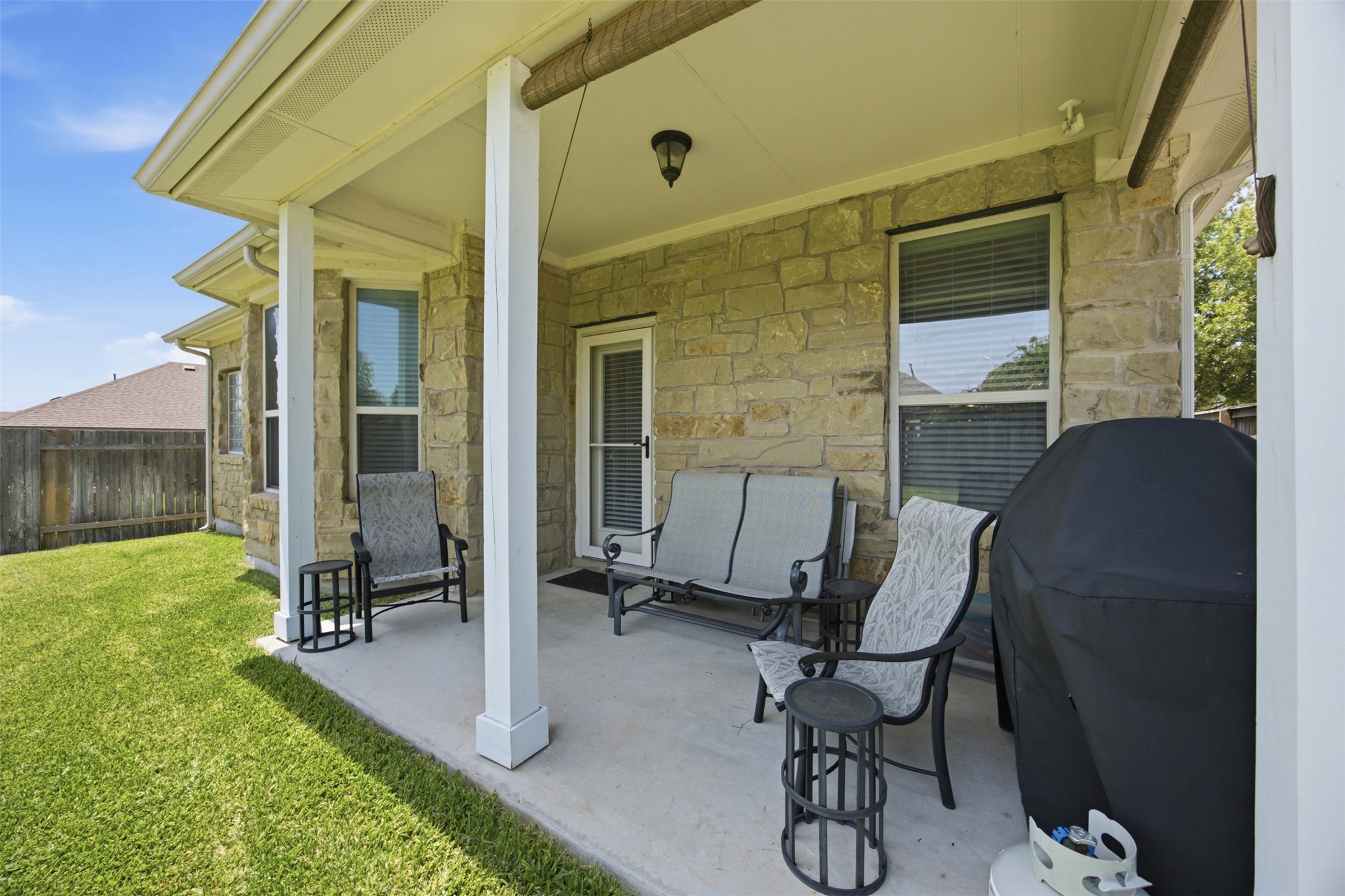 328 Rock Mill Loop Georgetown, TX 78626 - Photo 26 of 29 This shaded, private patio offers an ideal space for entertaining guests outdoors. It connects naturally to the spacious backyard beyond. It is a wonderful extension of the home's living space.