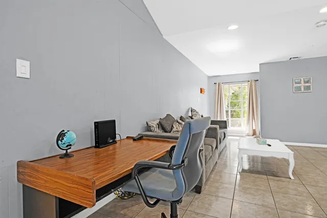 a view of a workspace with furniture