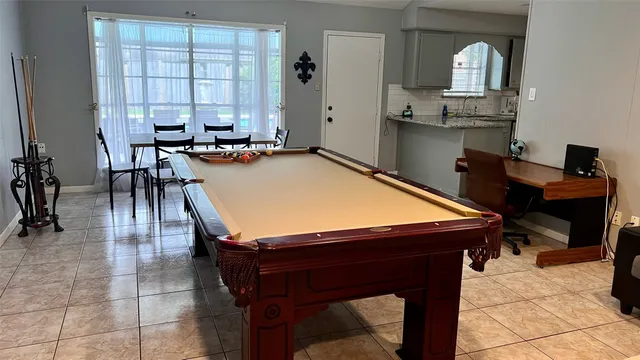 a room with dining table and chairs