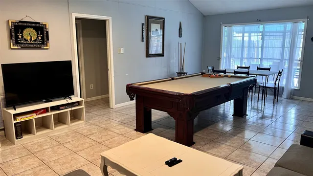 a room with furniture and a flat screen tv