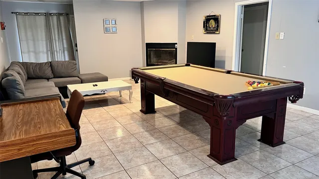 a room with furniture and air hockey table