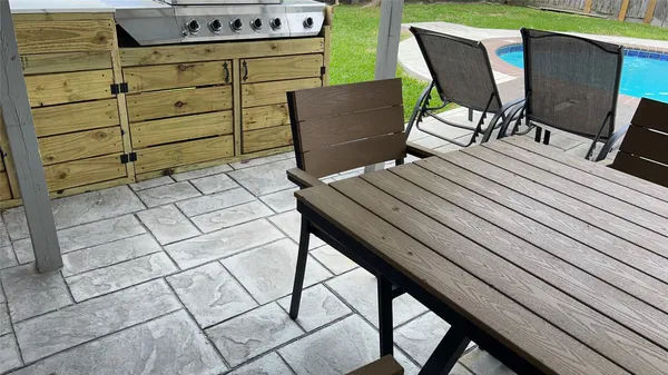 a view of a chairs and table in the terrace