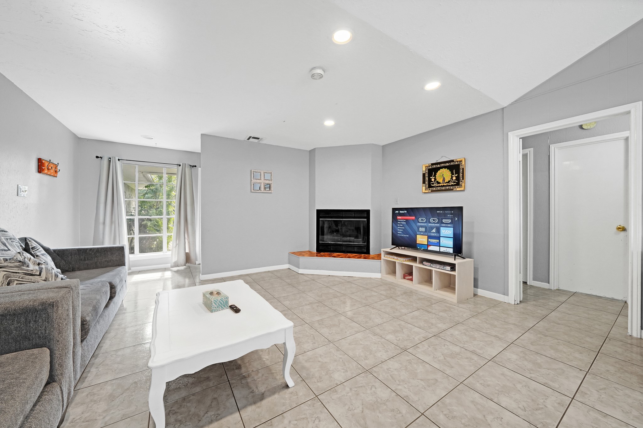 222 Wickhamford Way Houston, TX 77015 - Photo 8 of 27 a living room with furniture and a flat screen tv