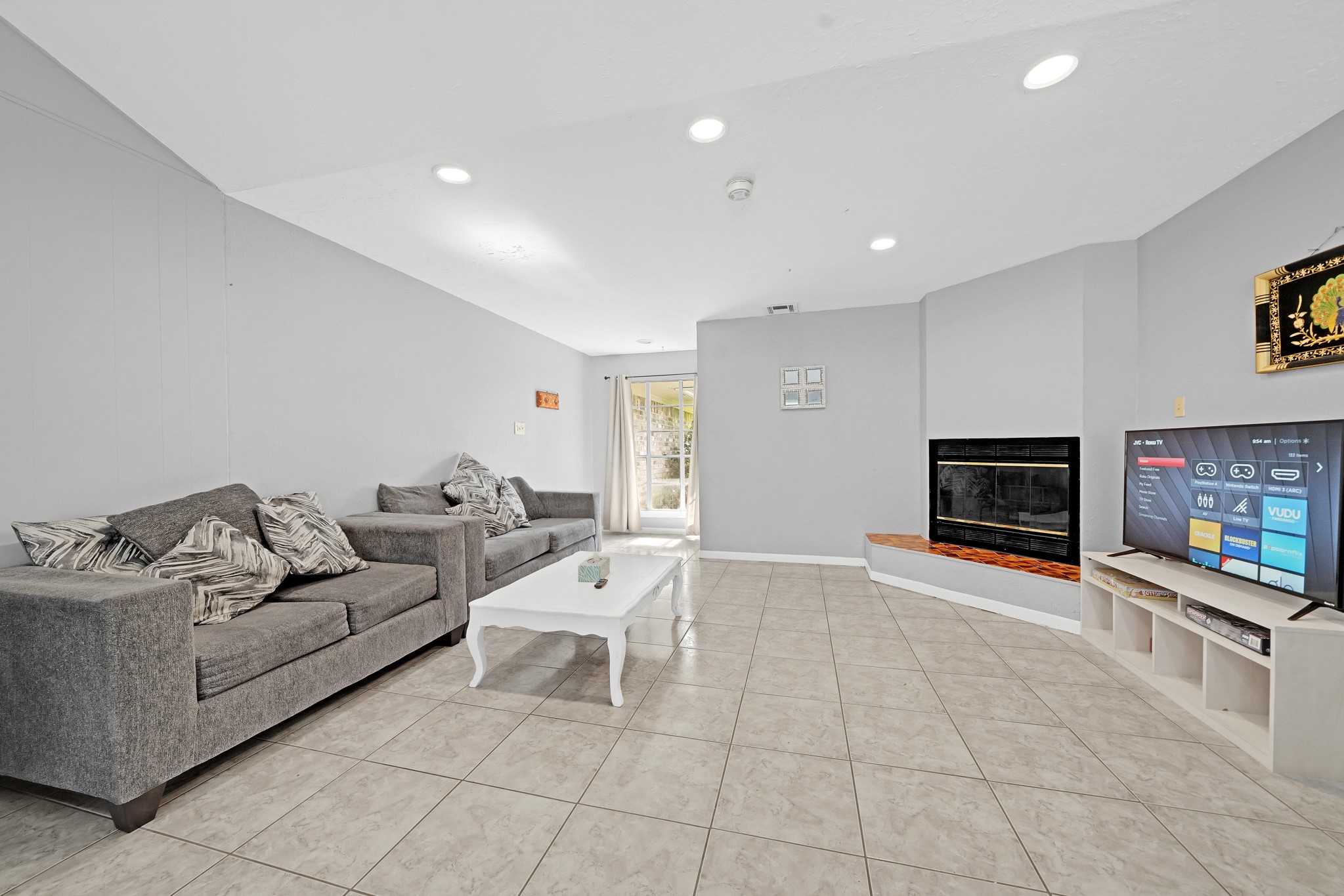 222 Wickhamford Way Houston, TX 77015 - Photo 9 of 27 a living room with furniture and a flat screen tv