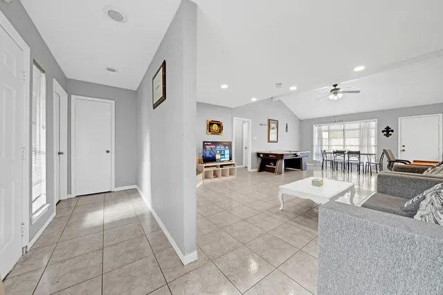 a living room with furniture and a table