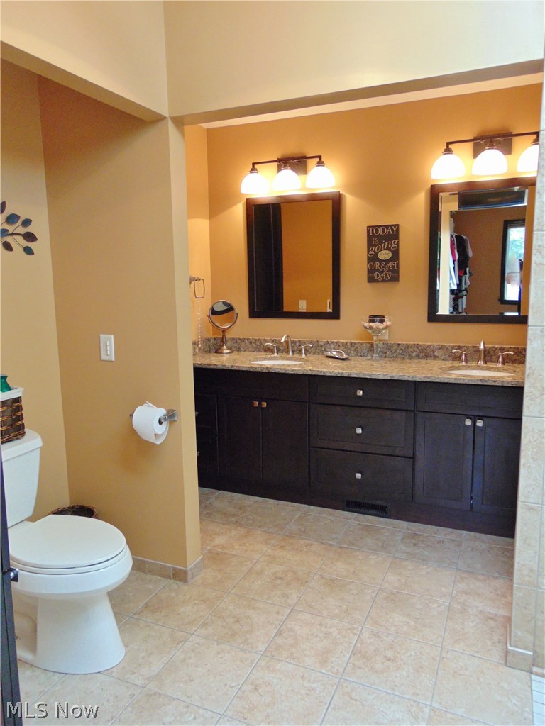4273 Sherman Road Kent, OH 44240 - Photo 16 of 35 Another view of the master bathroom with granite counter tops and ceramic tile floors
