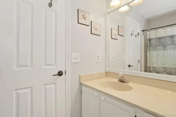 a bathroom with a shower curtain