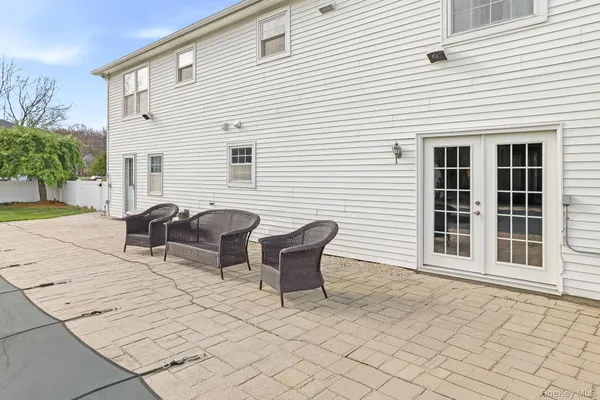 a view of a swimming pool with a yard