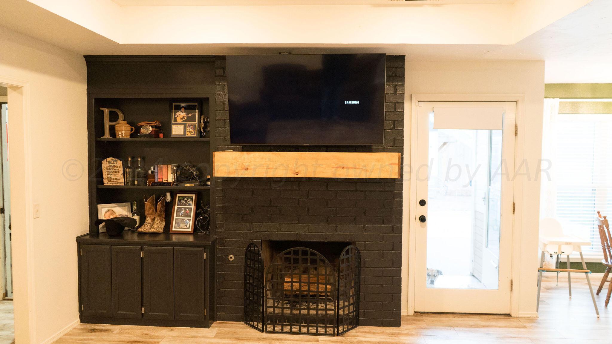 7513 Sheldon Road Amarillo, TX 79119 - Photo 8 of 27 living room fireplace