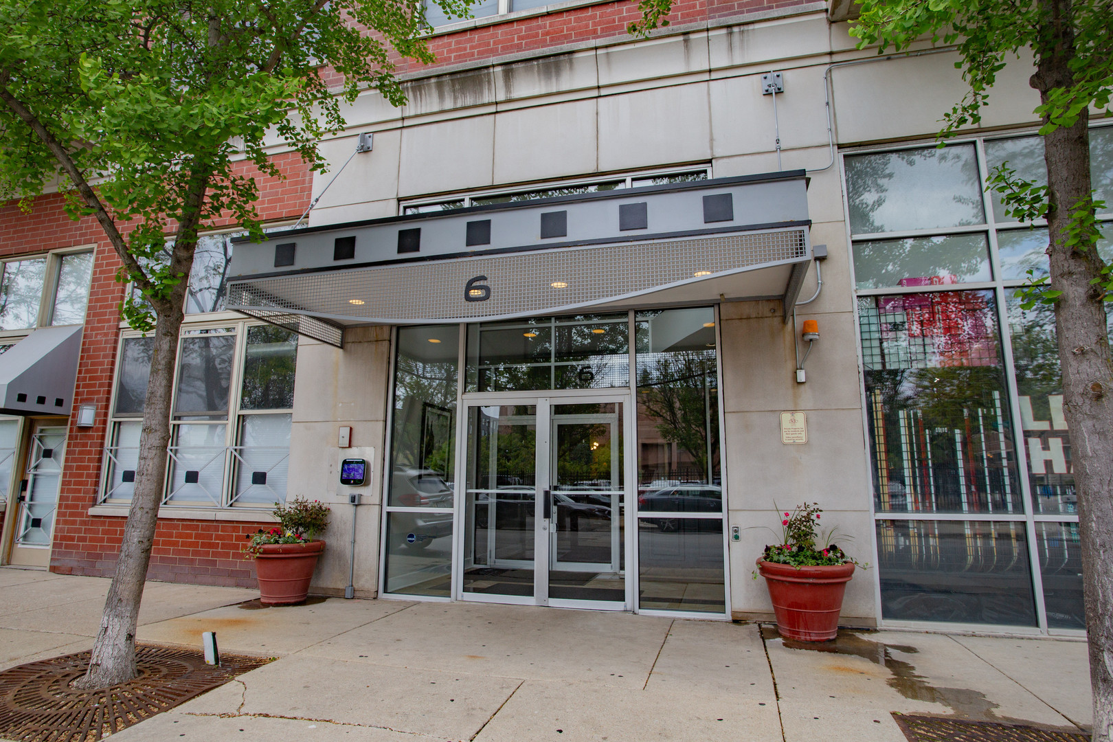 6 South Laflin Street, Unit 617 Chicago, IL 60607 - Photo 2 of 21 a front view of a building with outdoor seating area