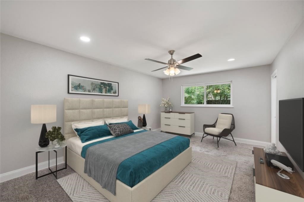 6007 Claridge Drive Houston, TX 77096 - Photo 1 of 38 a bedroom with a bed a couch and a window