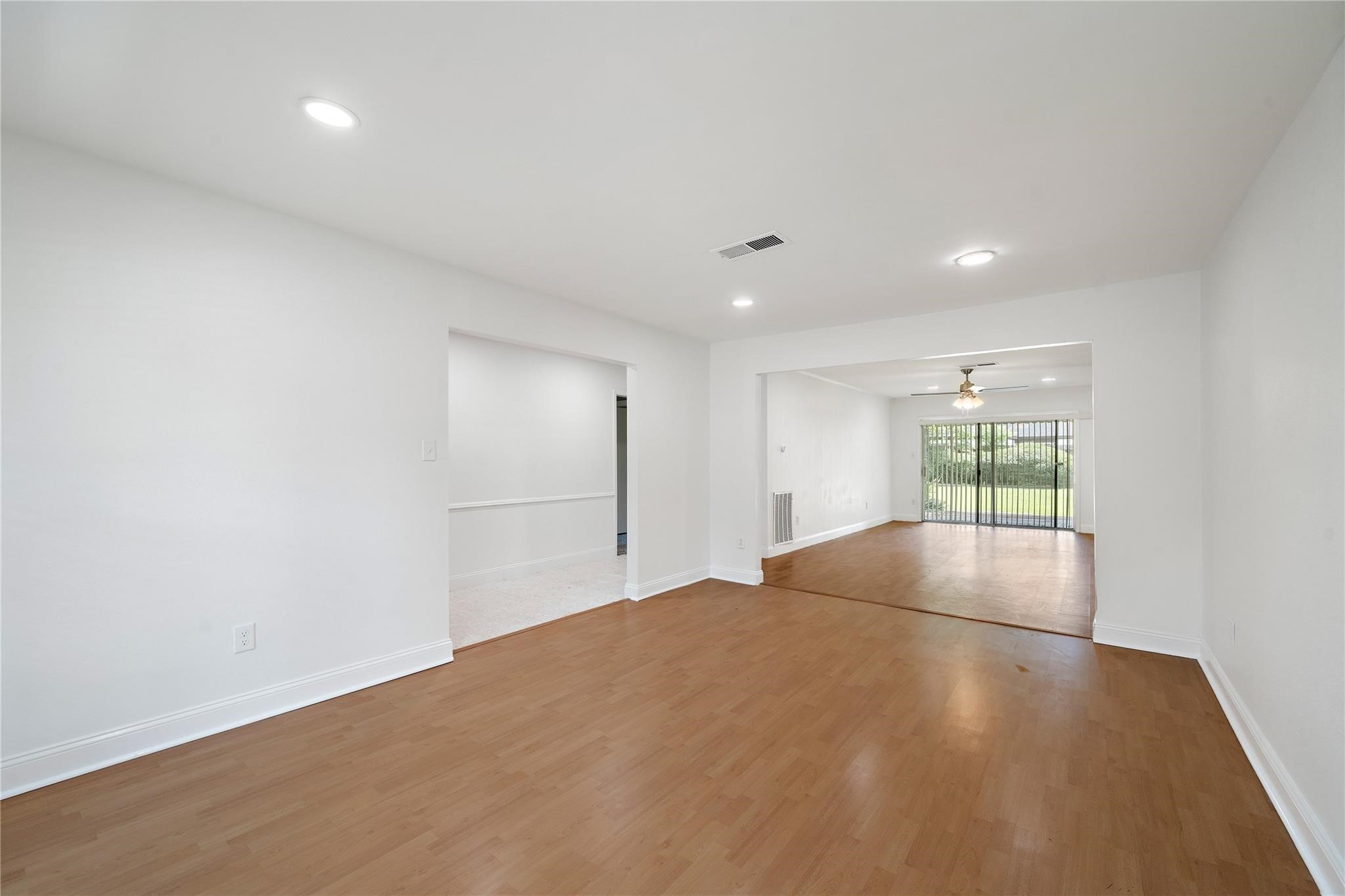 6007 Claridge Drive Houston, TX 77096 - Photo 29 of 38 a view of empty room with wooden floor and fan