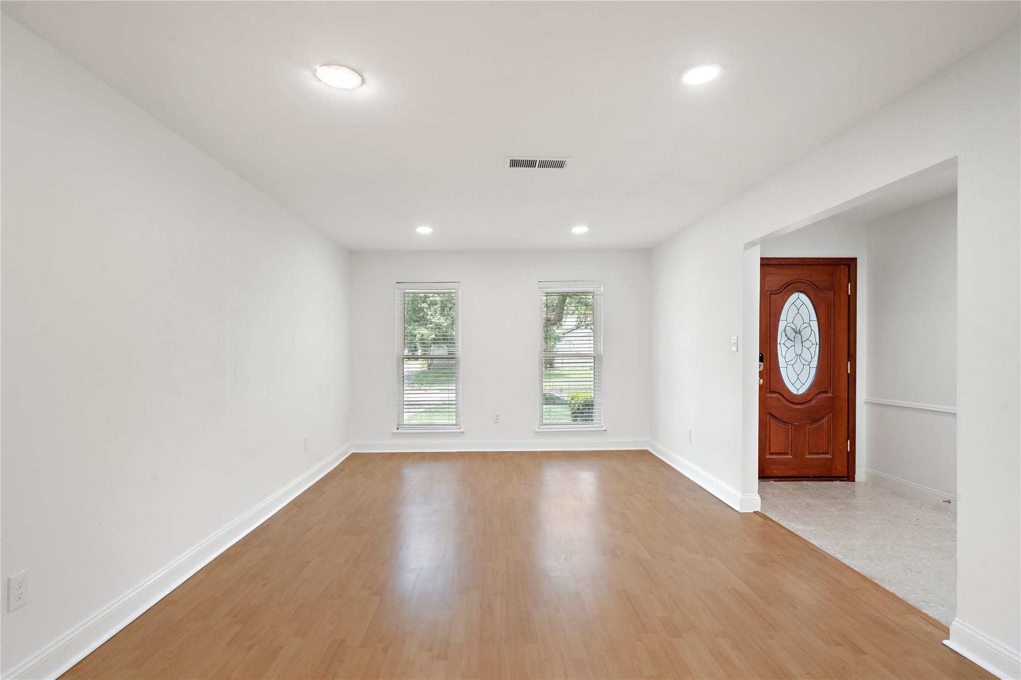 6007 Claridge Drive Houston, TX 77096 - Photo 8 of 38 wooden floor in an empty room with a window