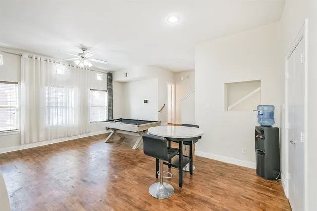 a view of a room with furniture window and wooden floor