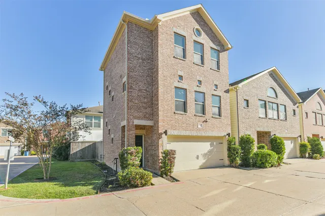 a front view of a building with garden