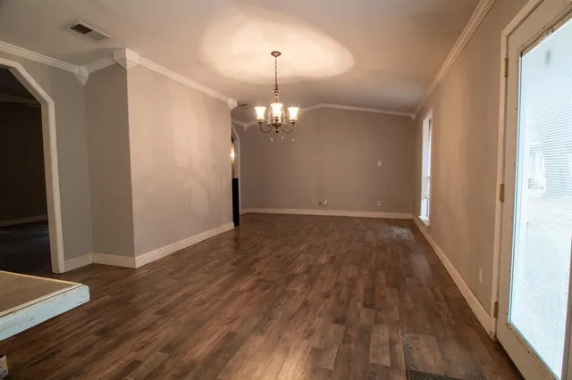 a view of a livingroom with wooden floor