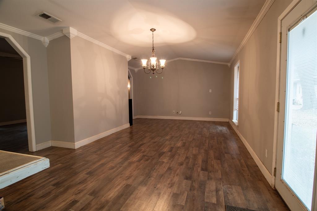 1088 Pheasant Road Gladewater, TX 75647 - Photo 9 of 31 a view of a livingroom with wooden floor