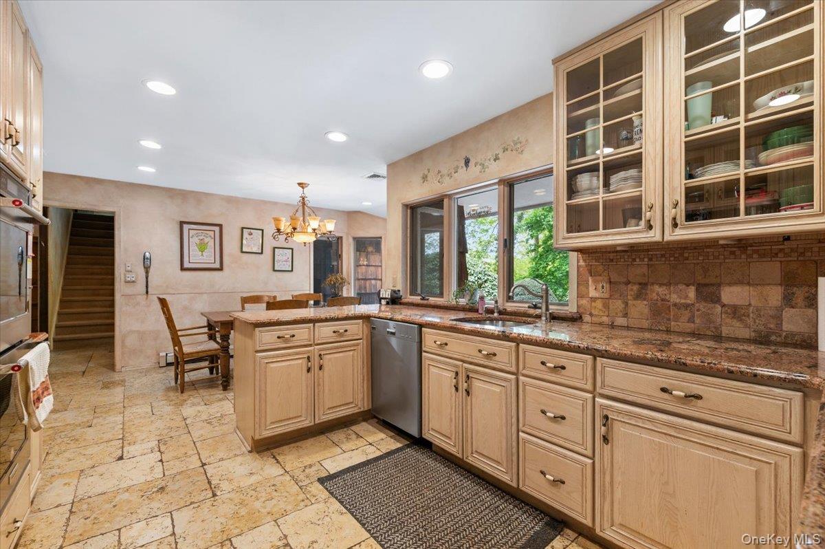 6 Apex Road Melville, NY 11747 - Photo 16 of 50 a kitchen with lots of counter top space and windows