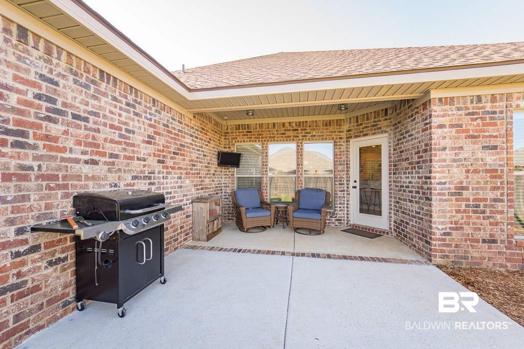 8668 Rosedown Lane Daphne, AL 36526 - Photo 17 of 19 Covered Porch and Patio